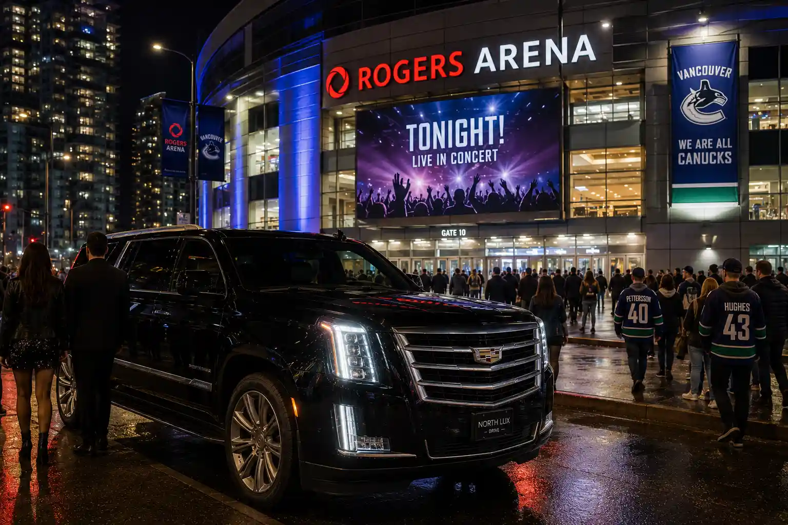 Black Cadillac luxury SUV parked outside Rogers Arena in Vancouver BC at night with excited fans, concert crowds, arena lights, and city buildings in the background, providing premium transportation for concerts, hockey games, and sporting events.