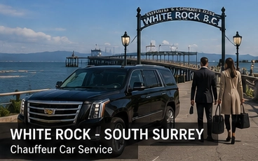 Black Cadillac Escalade luxury SUV near White Rock BC waterfront and pier with ocean views, providing premium chauffeur transportation service.