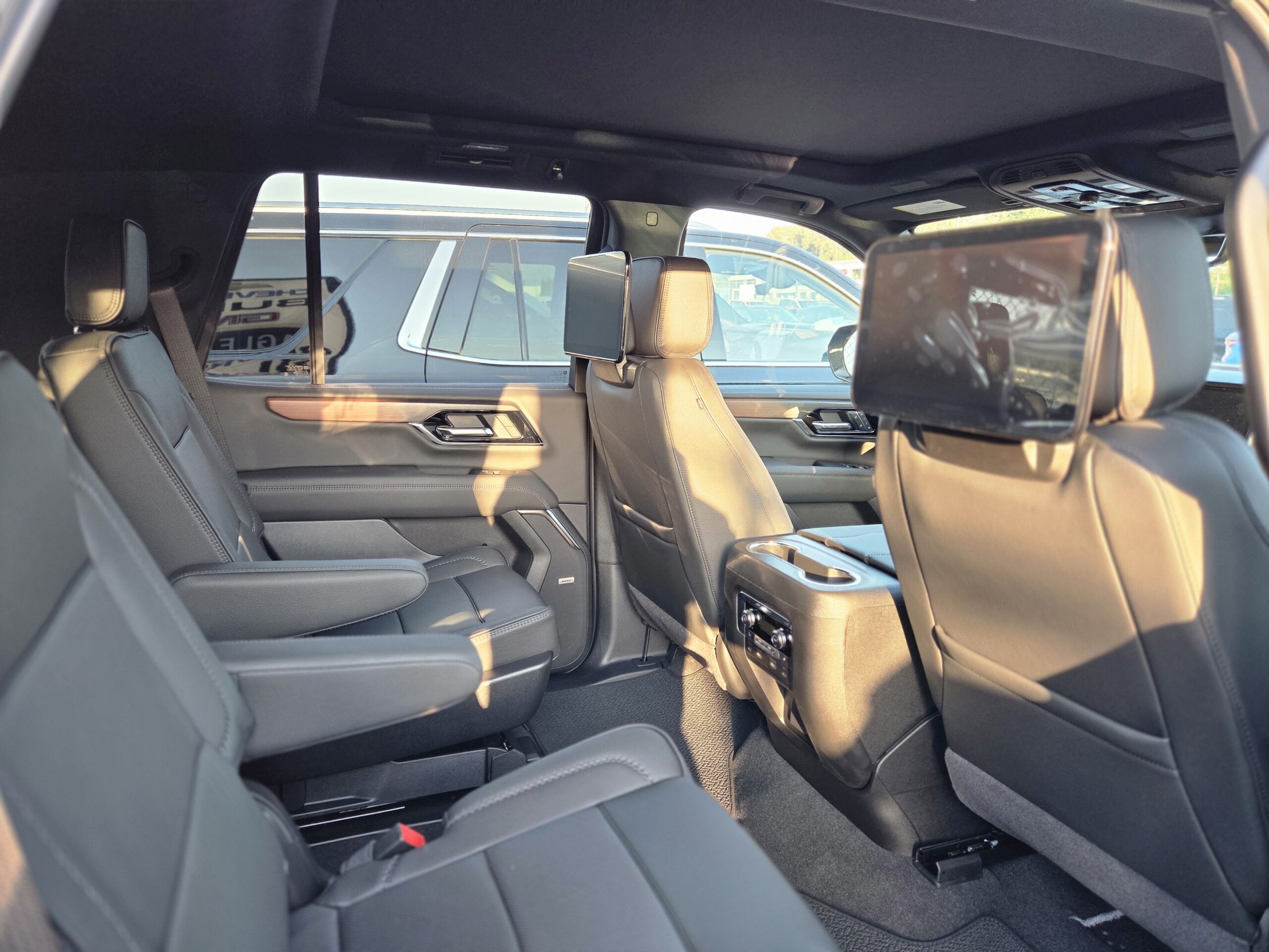 Interior of a Yukon Denali with 2 screens fleet of NorthLuxDrive
