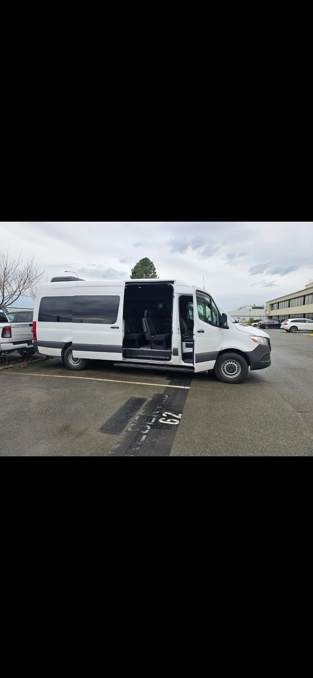 White passenger van for group transfer to Whistler